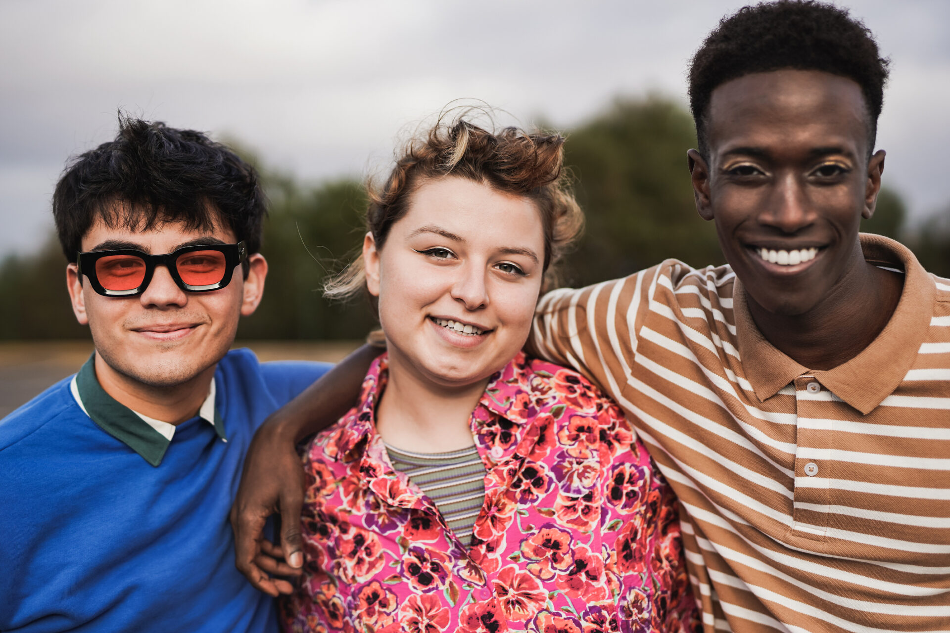 Young multiracial friends smiling on camera - Concept of diversity