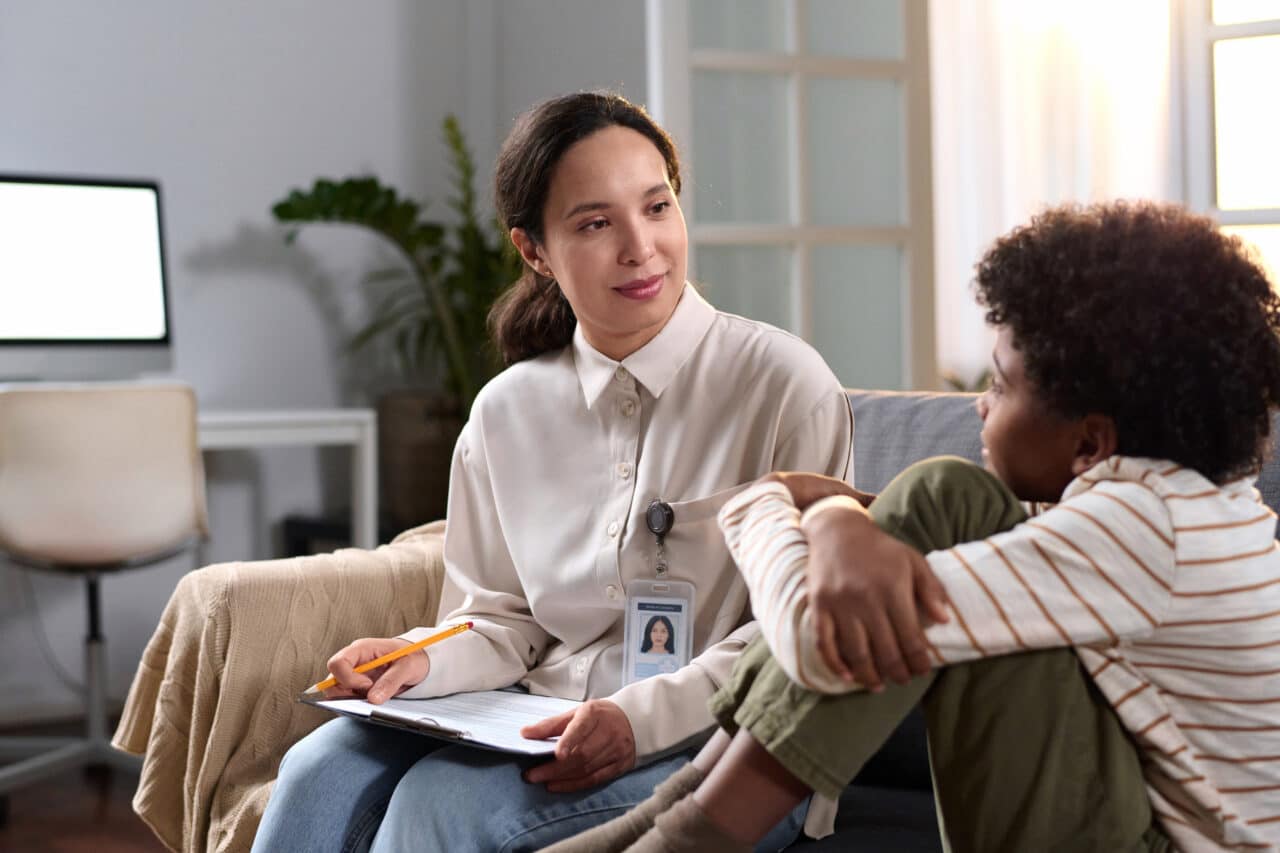 Therapist Talking to Young Boy