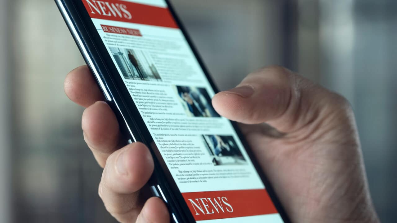 Reading news on mobile phone