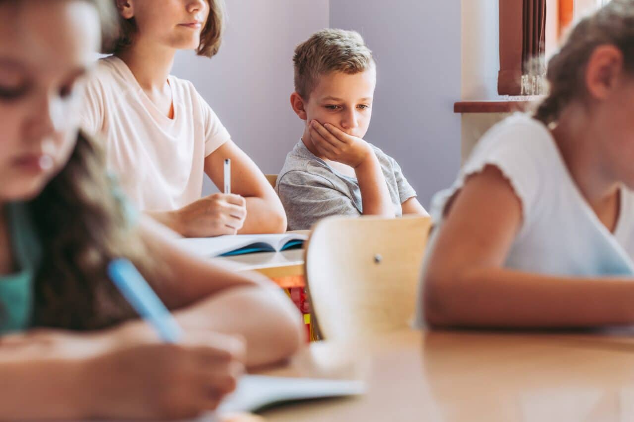 Sad boy in classroom